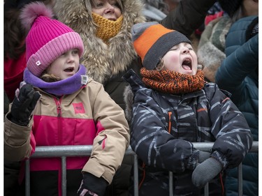 Making sure everyone hears him five-year-old William Bisson-Morin, yells out while enjoying the Montreal Santa Claus parade with friend Anais Olivier on Saturday, Nov. 25, 2023.