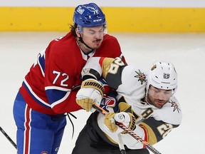 Canadiens' Arber Xhekaj, left, collides with Golden Knights' William Carrier during second period Thursday night at the Bell Centre.
