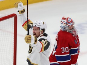 Vegas Golden Knights' Mark Stone raises his arms in the air with Canadiens goaltender Cayden Primeau looking dejected