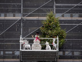 snowman, christmas tree on a scaffolding