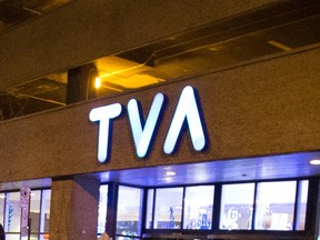 The TVA logo is visible on a building exterior at night