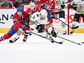 Canadiens' Rafaël Harvey-Pinard challenges Pavel Zacha of the Boston Bruins during the second period at the Bell Centre on Saturday, Nov. 11, 2023, in Montreal.