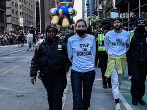 Pro-Palestinian protesters are detained during Macy's annual Thanksgiving Day Parade on Nov. 23, 2023 in New York City.
