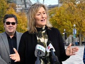 Magali Picard speaks into media microphones during an outdoor news conference
