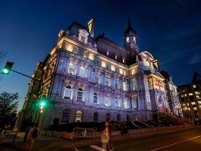 The exterior of Montreal city hall is pictured at dusk.