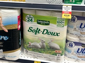 Packages of toilet paper on a store shelf