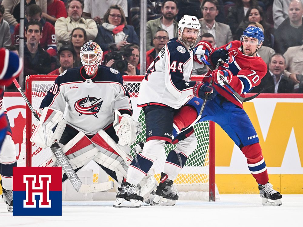 Erik Gudbranson of the Columbus Blue Jackets and Tanner Pearson of the Montreal Canadiens battle for position near Blue Jackets goaltender Elvis Merzlikins in the third period at the Bell Centre on Oct. 26, 2023