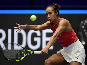 Canada's Leylah Fernandez from Laval returns the ball against Italy's Jasmine Paolini during the final singles tennis match between Italy and Canada on the last day of the Billie Jean King Cup Finals 2023 in La Cartuja stadium in Seville on Sunday, Nov. 12, 2023.