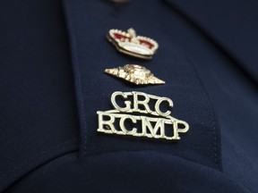 The RCMP logo is seen on the shoulder of a superintendent during a news conference in St. John's on Saturday, June 24, 2023. Three people were sent to hospital Friday after a stabbing at a mall just outside Calgary city limits.