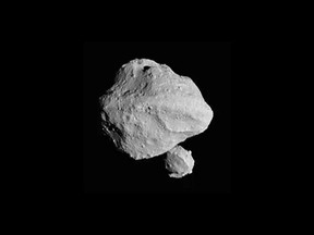This photo provided by NASA shows a photo taken by the Lucy spacecraft the Nov. 1, 2023, flyby of asteroid Dinkinesh, 300 million miles from Earth.