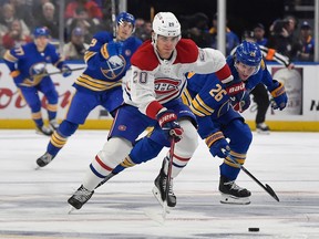 Canadiens' Juraj Slafkovsky skates the puck way from Sabres defencemen Rasmus Dahlin during a game last month.