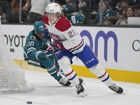 Canadiens defenceman Kaiden Guhle (21) skates with the puck against San Jose Sharks' Anthony Duclair