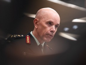 Chief of the Defence Staff Wayne Eyre waits to appear before the Standing Commitee on National Defence providing a briefing on the mandate and priorities of the minister of national defence in Ottawa, on Thursday, Sept. 28, 2023. Canada's top soldier says the military's ability to keep funding a "persistent presence" of warships in the western Pacific is a challenge due the budget restraints the military faces.