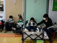 Children receive an IV drip at a hospital in Beijing on Nov. 23, 2023.