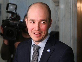 Alexandre Leduc in a hallway with TV cameras nearby