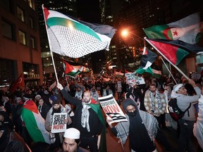 People attend a march for Gaza rally in support of Palestine in Toronto on Saturday, Nov. 4, 2023.