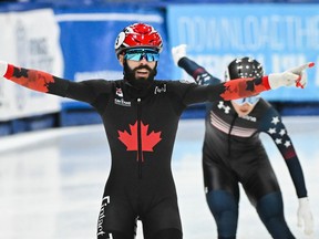 Quebecer Steven Dubois reacts after leading his team to a first place finish in 2000-metre mixed relay final race at the ISU Four Continents Short Track Speedskating Championships in Lava on Sunday, Nov, 5, 2023.
