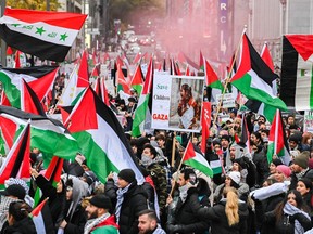 People take part in a pro-Palestinian rally in Montreal on Sunday, Nov. 12, 2023.