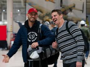 Alouettes head coach Jason Maas, left, and quarterback Cody Fajardo are seen inside the Canadian Warplane Heritage Museum in Hamilton on Monday.