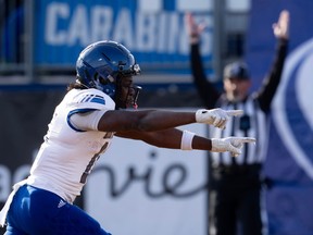Montreal Carabins receiver Iraghi Muganda celebrates his touchdown against the UBC Thunderbirds during Canadian University Football Championship Vanier Cup action on Saturday, Nov. 25, 2023, in Kingston, Ont.