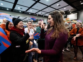 Émilise Lessard-Therrien, right, reacts with a supporter after being chosen as the new co-spokesperson of Québec solidaire at their convention in Gatineau on Sunday, Nov.26, 2023.