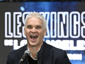 Los Angeles Kings president Luc Robitaille laughs during a news conference, Tuesday, Nov. 14, 2023 at the Vidéotron Centre in Quebec City.