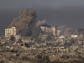 Smoke rises following an Israeli bombardment in the Gaza Strip, as seen from southern Israel, Thursday, Nov. 23, 2023.