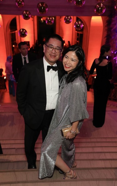 Guests including American Iron & Metal group chief financial officer Richard Pan and wife, MMFA board member Clare Chiu, vice-president of Warwick Hotels and Resorts, make their way into the recent MMFA Ball.