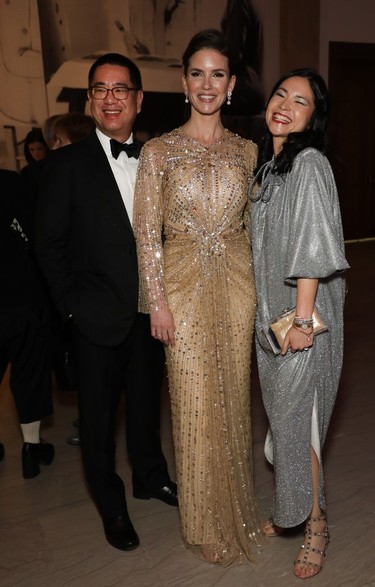 MMFA chief curator Mary Dailey-Desmarais (radiant in Jenny Packham) flanked by American Iron & Metal group chief financial officer Richard Pan and wife, MMFA board member Clare Chiu, vice-president of Warwick Hotels and Resorts, at the recent MMFA Ball.
