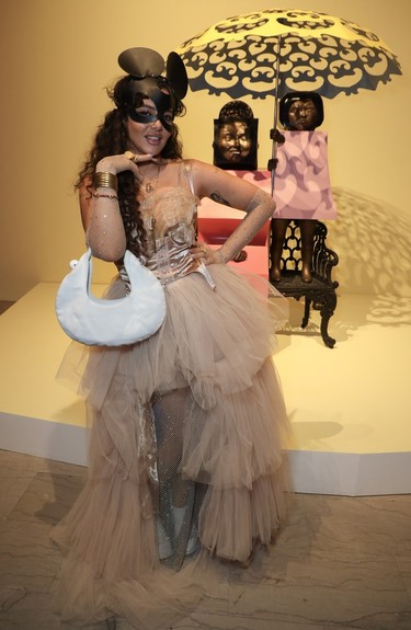 Artist MissMe, a designer of one of the eve's gobsmackingly gorgeous dinner galleries, strikes a pose close to an installation by visionary artist Marisol, whose '60s and '70s talent and exuberance inspired the Montreal Museum of Fine Arts Ball, held on Saturday, November 19, 2023.