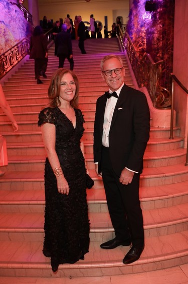 Marie-Josée Desrochers, president/CEO, Société de la Place des Arts, and husband Charles Martin make their way into the recent MMFA Ball.