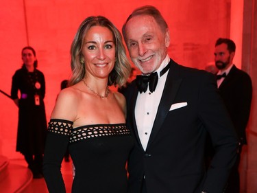 Carine Watier, stunning in a simple black sheath, and her husband Barry F. Lorenzetti, the force behind BFL Canada and founder of the Barry F. Lorenzetti Foundation, attend the Montreal Museum of Fine Arts Ball on Saturday, November 18, 2023.