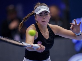 Canada's Marina Stakusic returns the ball to Spain's Rebeka Masarova during their group stage tennis match between Spain and Canada on the second day of the Billie Jean King Cup finals at La Cartuja stadium in Seville, southern Spain, Wednesday, Nov. 8, 2023.THE CANADIAN PRESS/AP/Manu Fernandez