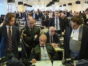 Officials listen as judges read the verdicts of a maxi-trial of hundreds of people accused of membership in Italy's 'ndrangheta organized crime syndicate in Lamezia Terme, southern Italy, Monday, Nov. 20, 2023.