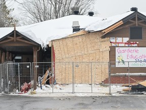 The scene outside a daycare centre in Laval is shown on Thursday, Feb.9, 2023, after a bus crashed into the building, killing two children.
