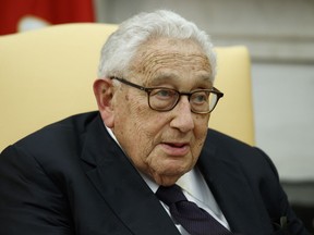FILE - Former Secretary of State Henry Kissinger speaks during a meeting with President Donald Trump in the Oval Office of the White House, Oct. 10, 2017, in Washington. Kissinger, the diplomat with the thick glasses and gravelly voice who dominated foreign policy as the United States extricated itself from Vietnam and broke down barriers with China, died Wednesday, Nov. 29, 2023. He was 100.