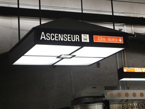 Photo shows an illuminated sign indicating elevators in the Bonaventure métro station in Montreal.