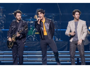 The Jonas Brothers, from left, Kevin, Joe and Nick, perform at the Bell Centre in Montreal on Friday, Dec. 1, 2023.