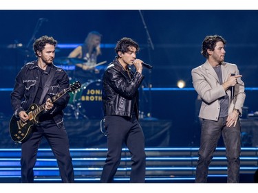 The Jonas Brothers, from left, Kevin, Joe and Nick, perform at the Bell Centre in Montreal on Friday, Dec. 1, 2023.
