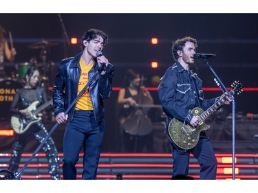 Joe and Kevin Jonas perform at the Bell Centre in Montreal on Friday, Dec. 1, 2023.