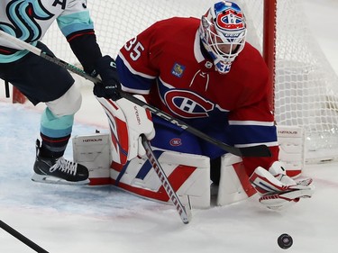 The puck is loose next to the Canadiens' crease
