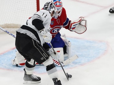 The puck is on a Kings player's stick just outside the Montreal crease