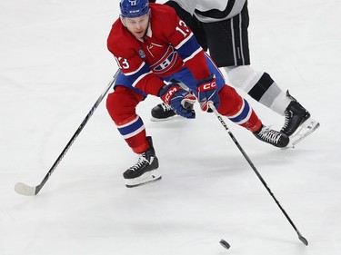 Canadiens' Mitchell Stephens (13) gets to the puck before Los Angeles Kings' Vladislav Gavrikov behind him