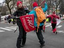 Parents showed their support during an early-morning protest for striking teachers at Notre-Dame-de-Grâce School on Tuesday December 12, 2023.