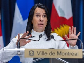 Mayor Valérie Plante gestures with her hands behind a podium with a sign that reads Ville de Montréal