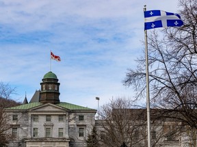 Photo shows flags of Quebec and McGill at McGill's downtown campus in Montreal.