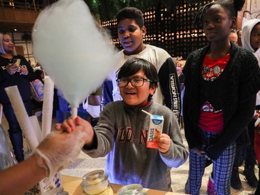 Happy youngsters in the cotton candy line at an event called One Magic Moment in Montreal on Sunday, Dec. 17, 2023.