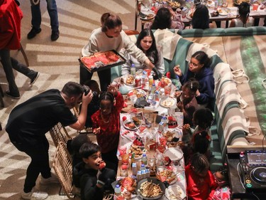 Young people enjoy the offerings at a holiday event called One Magic Moment in Montreal on Sunday, Dec. 17, 2023.