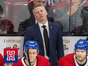 Martin St. Louis closes his eyes and sighs behind the bench
