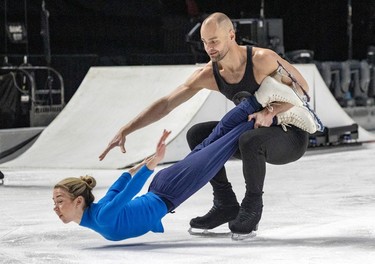 Stuart Widdall spins Stina Martini close to the ice during rehearsals for the new Cirque du Soleil ice show Crystal at the Bell Centre in Montreal on Thursday, Dec. 21, 2023.